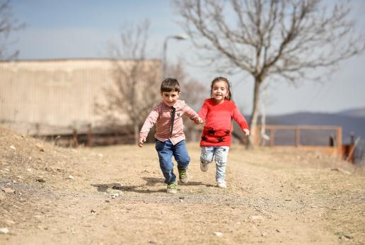 Two children holding hands